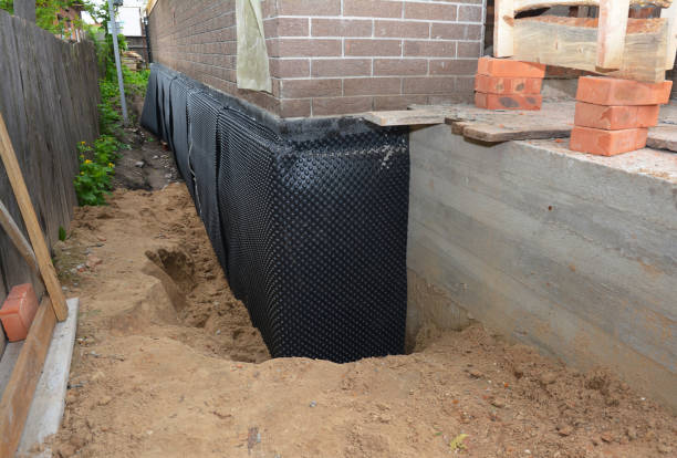 Happy homeowners after waterproofing job in Merrick